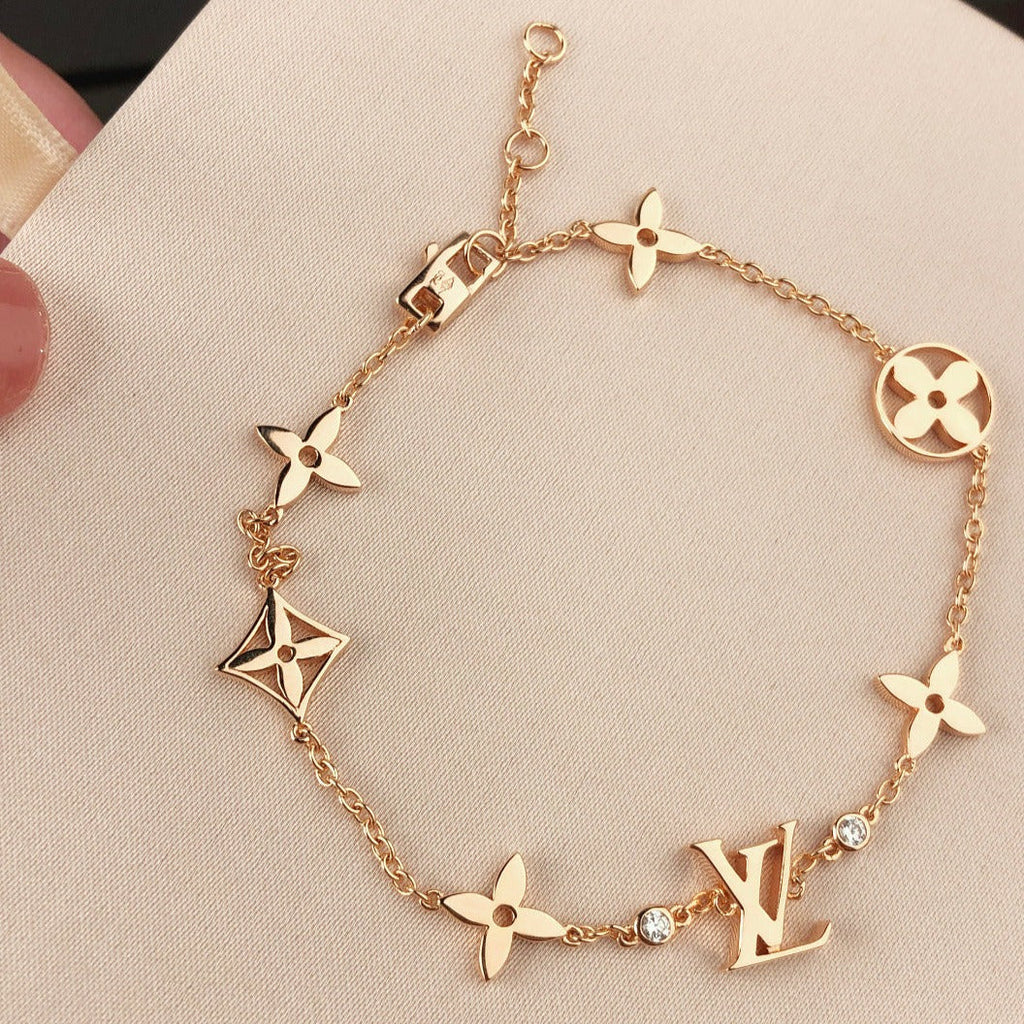 GlowSTAR AND SUN 7 MOTIFS GOLD BRACELET