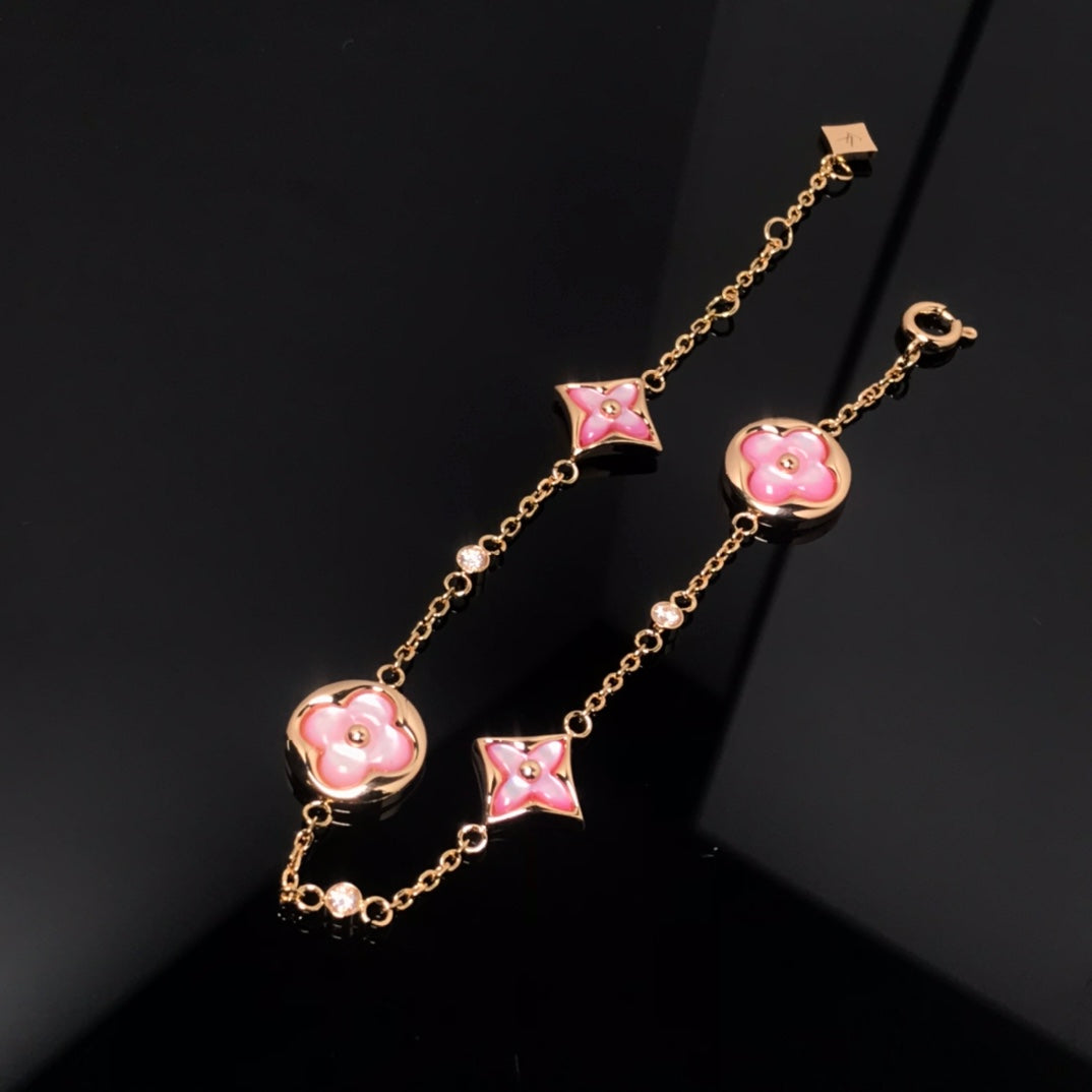 GlowSTAR AND SUN 4 MOTIF PINK MOP PINK GOLD BRACELET