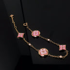 GlowSTAR AND SUN 4 MOTIF PINK MOP PINK GOLD BRACELET