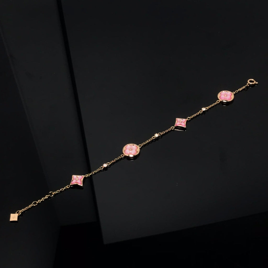 GlowSTAR AND SUN 4 MOTIF PINK MOP PINK GOLD BRACELET