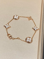 GlowSTAR AND SUN 5 MOTIF MOP PINK GOLD BRACELET