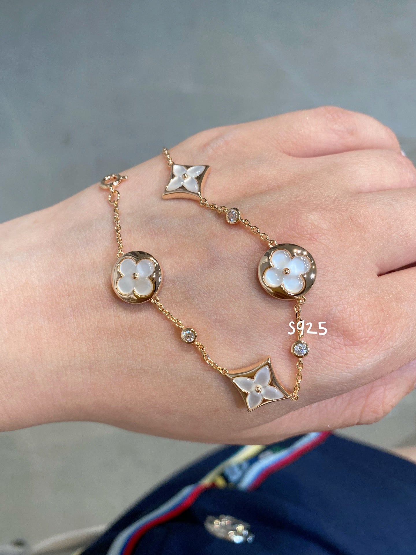 GlowSTAR AND SUN 4 MOTIF WHITE MOP PINK GOLD BRACELET
