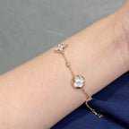 GlowSTAR AND SUN 4 MOTIF WHITE MOP PINK GOLD BRACELET