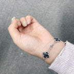 GlowCLOVER 5 MOTIF VEINED ONYX BRACELET SILVER