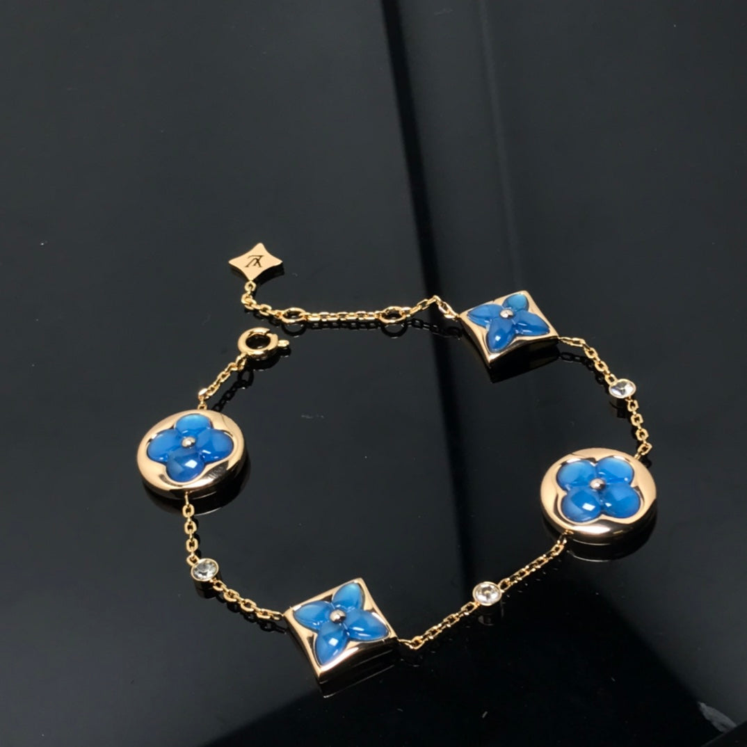GlowSTAR AND SUN 4 MOTIF BLUE BRACELET